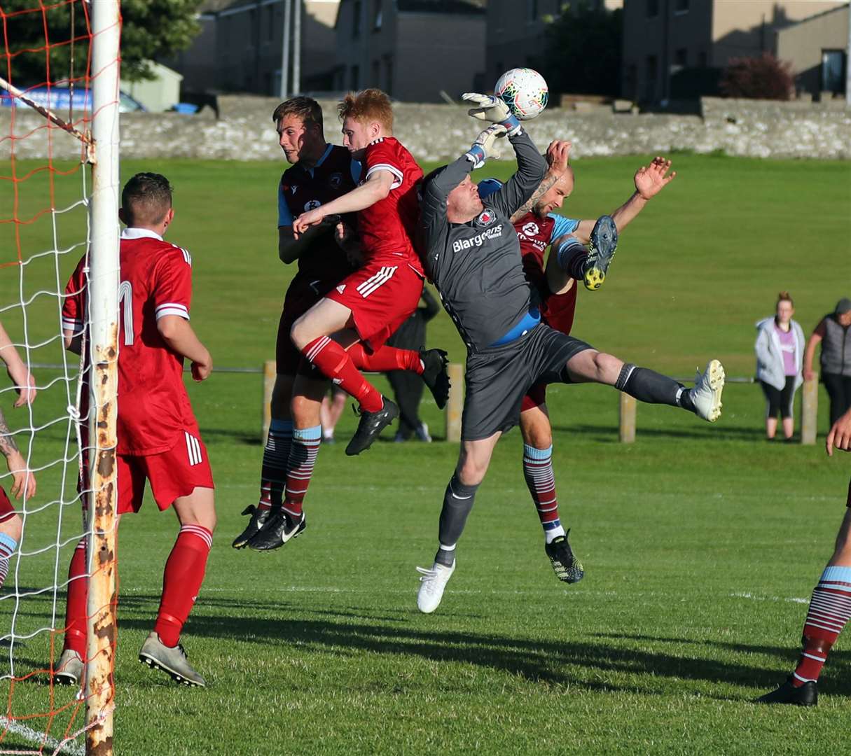 Pentland United keeper James More comes under pressure from Wick Groats' Stewart Atkins. Picture: James Gunn