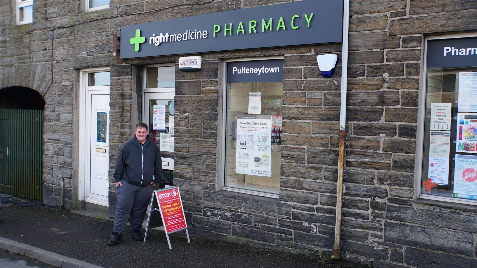 Customers at Pulteneytown Pharmacy have to follow strict guidelines posted on the door.