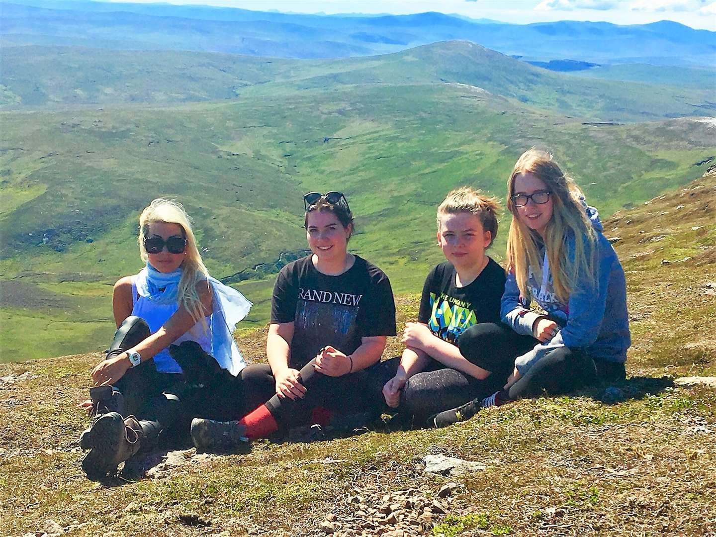 Megan with Natalie Oag and girls from the Horsin' Around stable after climbing Morven for charity.