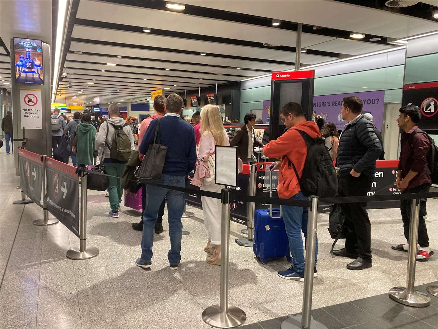 Passengers queue for flights at Heathrow (Ben Smith/PA)