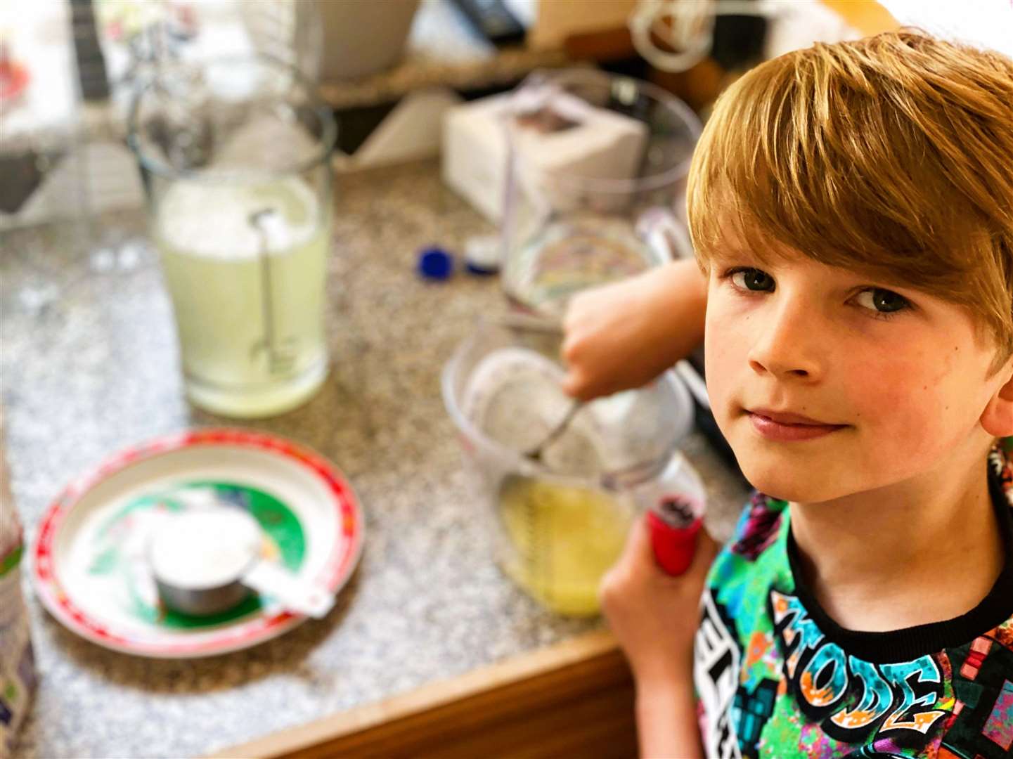 Ollie being busy in the kitchen with the unique lemonade recipe.