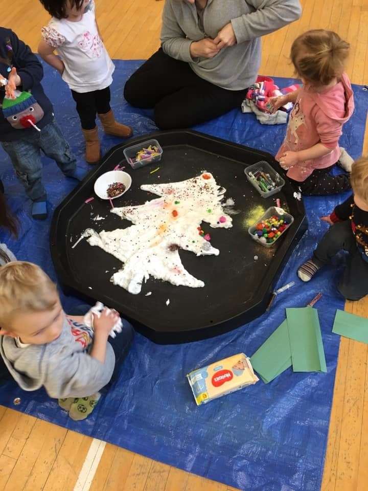 Toddlers at Watten Wee Ones creating a crafty Christmas tree.