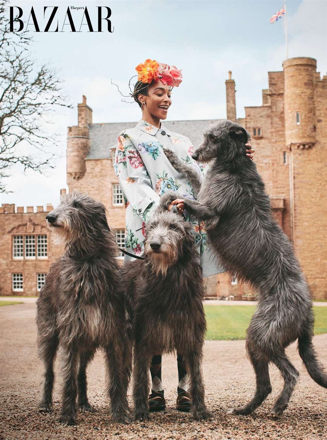 The magic moment when Beulah the deerhound tried to eat supermodel Jourdan's flowery crown. Picture: Harper’s Bazaar UK/Richard Phibbs