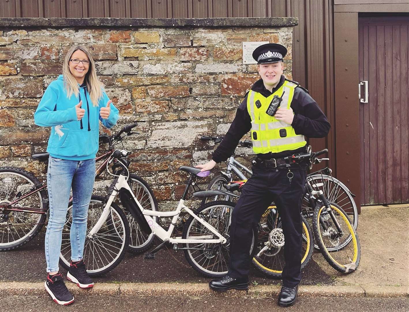 PC Matthew Thain with Jill Innes of High Life Highland with some of the donated bikes at Thurso High School.