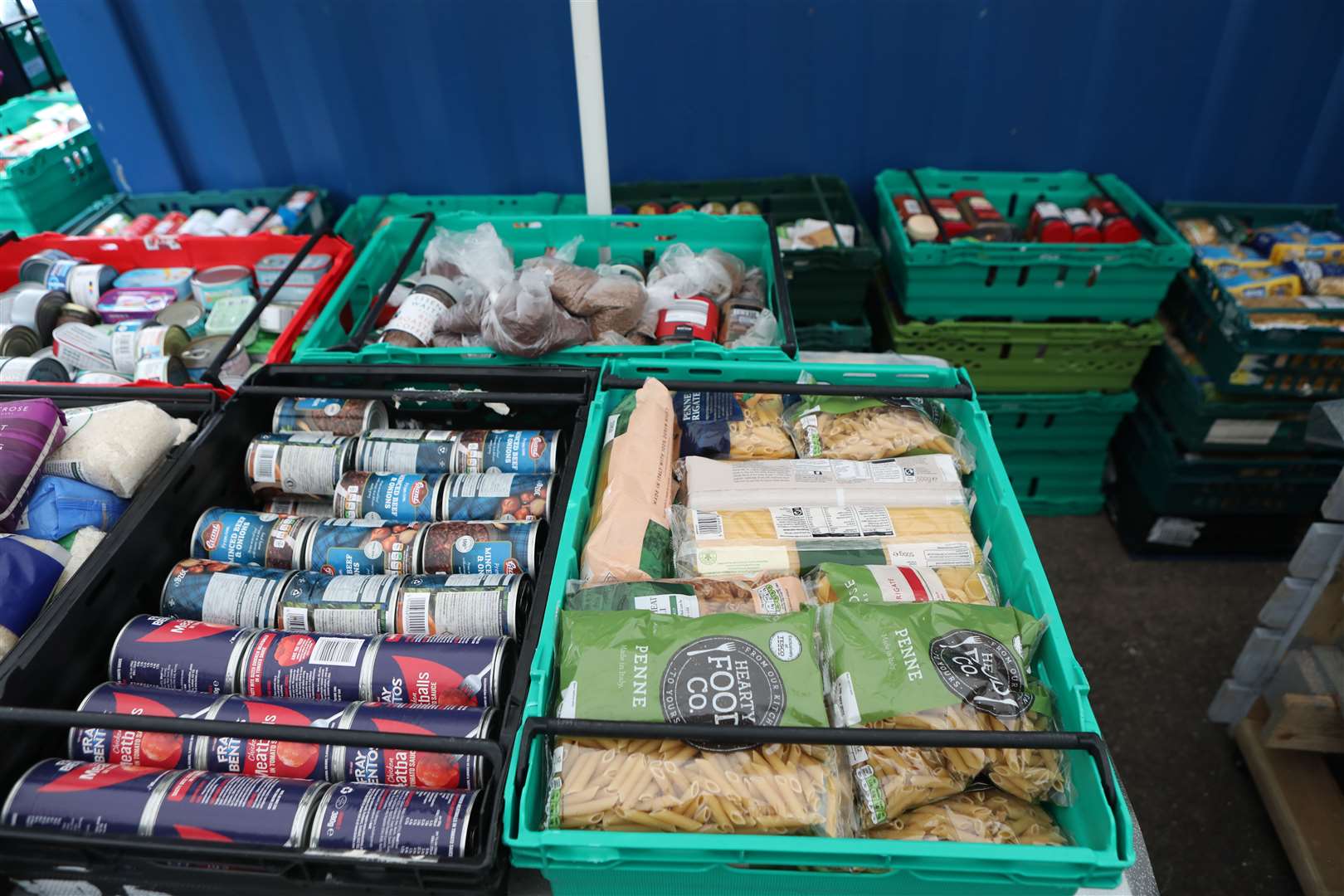 Food laid out in crates at a food bank (Luciana Guerra/PA)