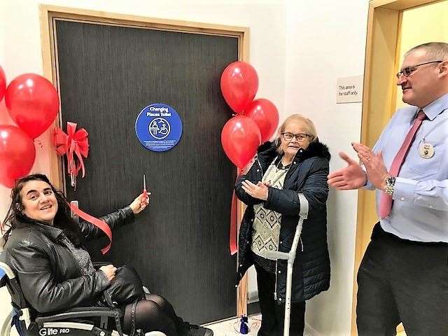 Louise Smith (left) cuts the ribbon while her colleague from the disability access group, Helen Budge, looks on along with Wick Tesco store manager Mark Driver.