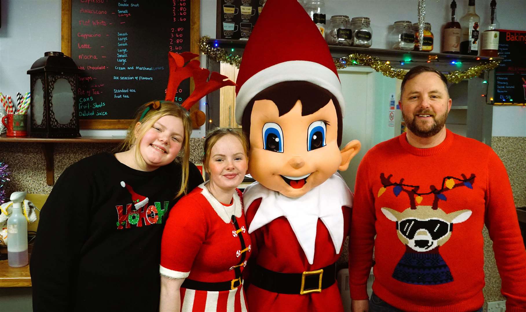 Manager of Messy Nessy Ian Carlisle with his daughters and festive character Elfie. Picture: DGS