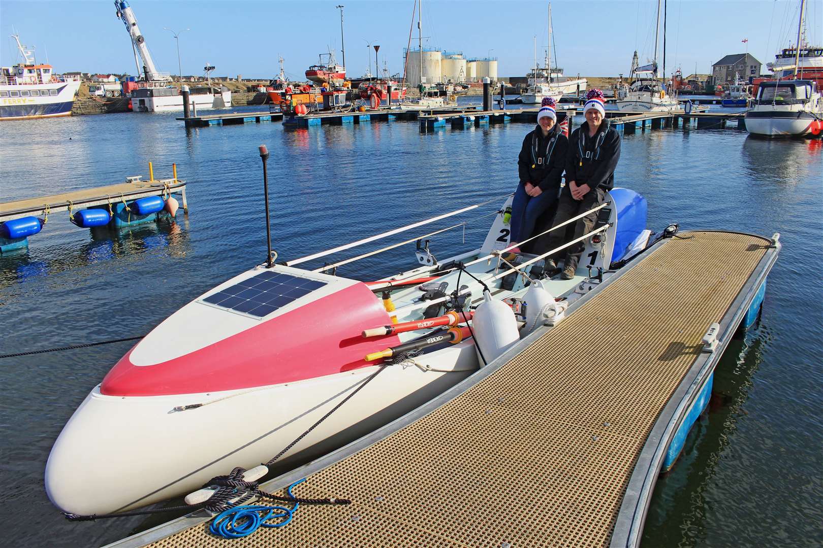 Mhairi Ross and Allan Lipp on their seven-metre-long Rannoch R15 rowing boat at Wick harbour. Picture: Alan Hendry