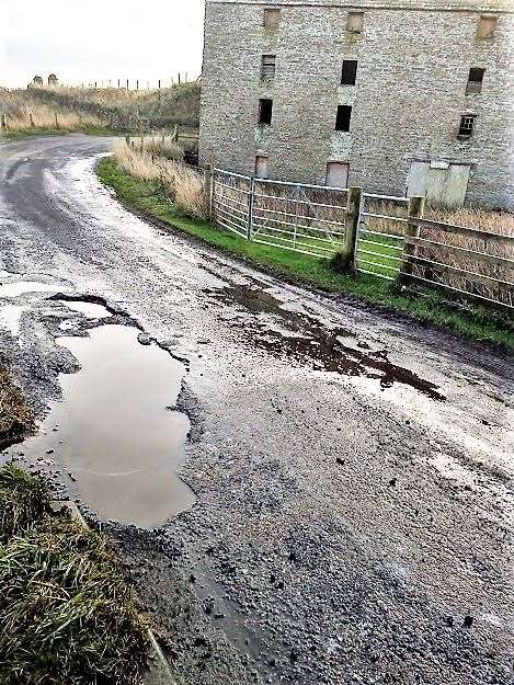 Photos from the road at Ham taken in November 2021 showing how badly potholed it is. Picture: CRR