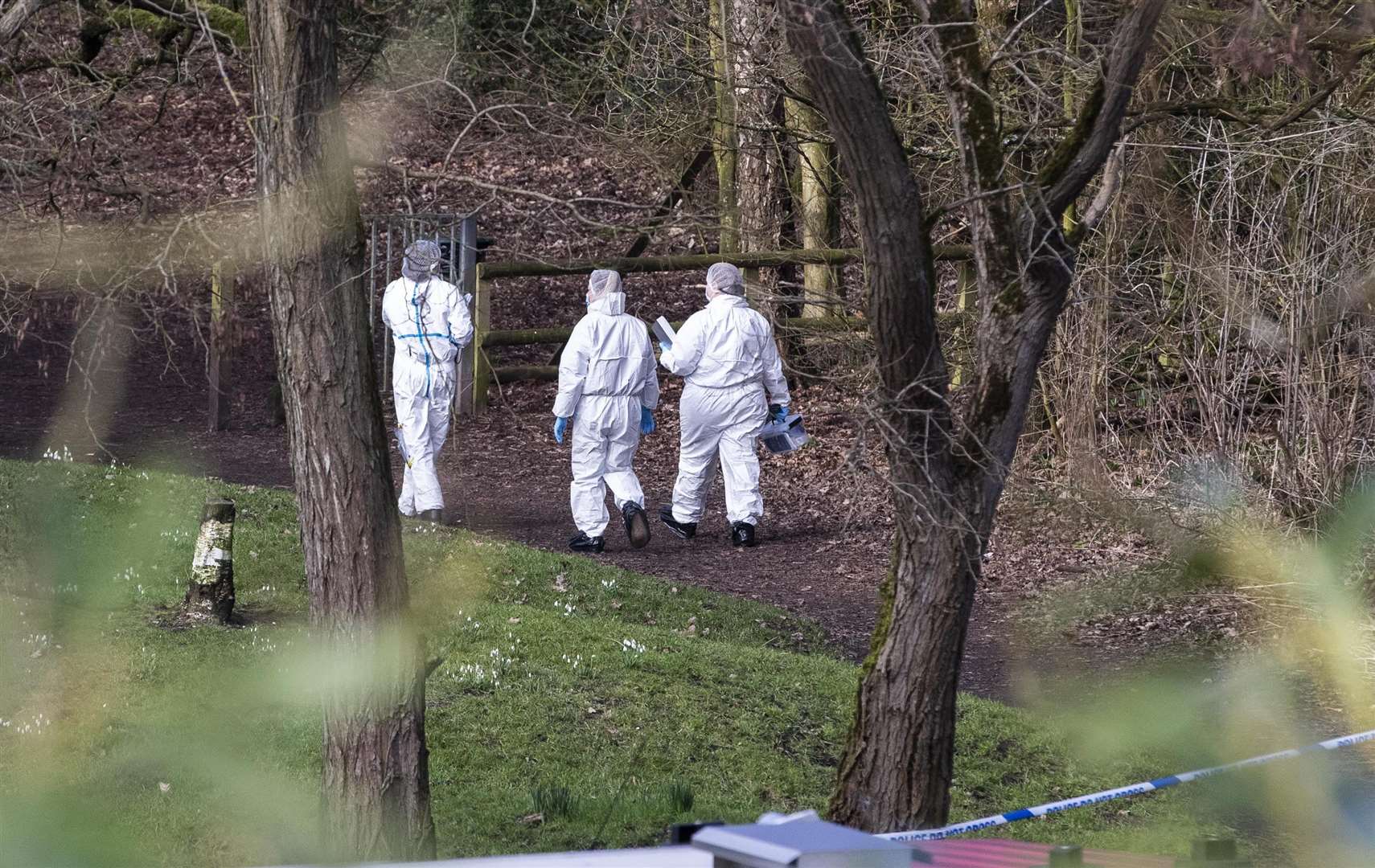 Police forensics officers at the scene in Culcheth Linear Park in Warrington following the death of Brianna Ghey (Jason Roberts/PA)