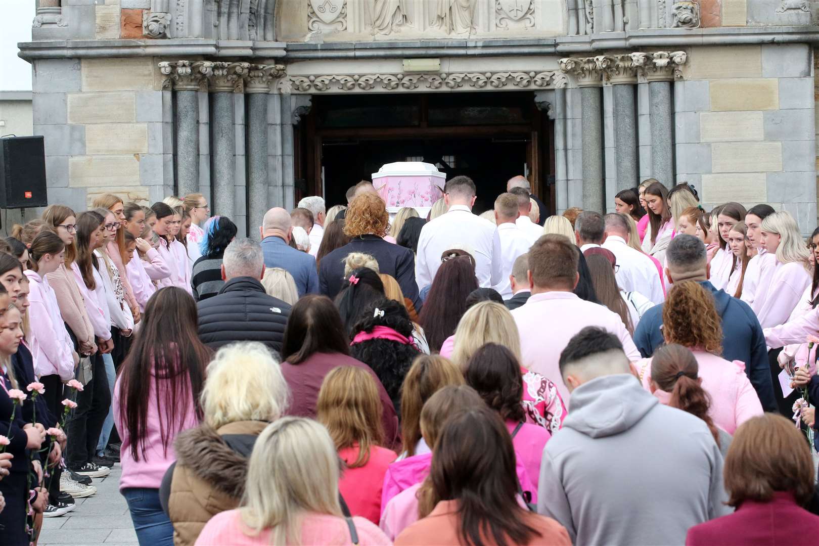 The coffin is carried into Saints Peter and Paul’s Church (Brendan Gleeson/PA)