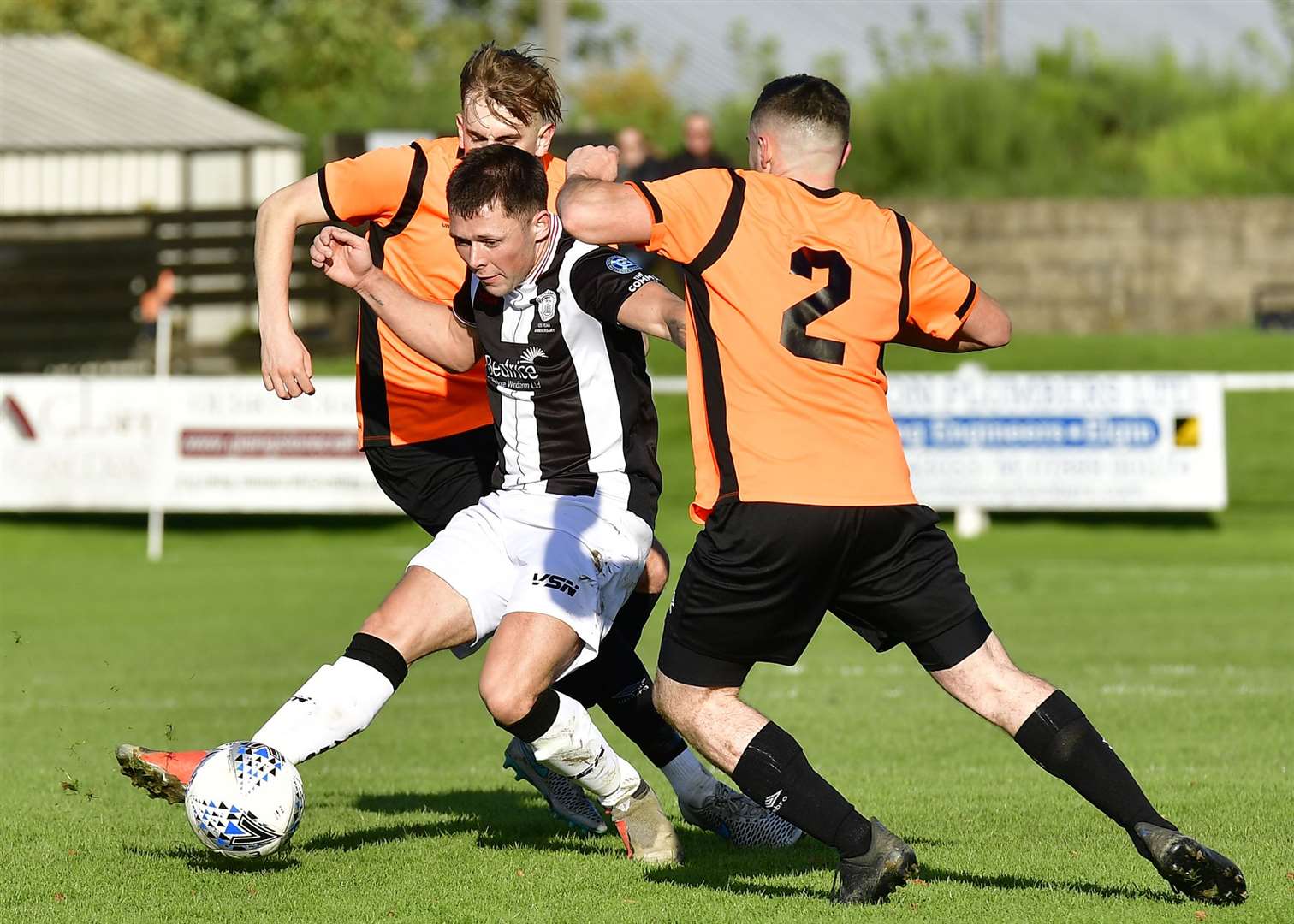Wick Academy's Jack Henry finds himself sandwiched between Rothes' Fraser Robertson and Alasdair Stark during the Scorries' 3-1 loss to the Speysiders. Picture: Mel Roger