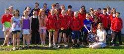 Swimmers from the Thurso and Orkney teams. The Pentland Trophy is being held by Ellie Spencer of Thurso.