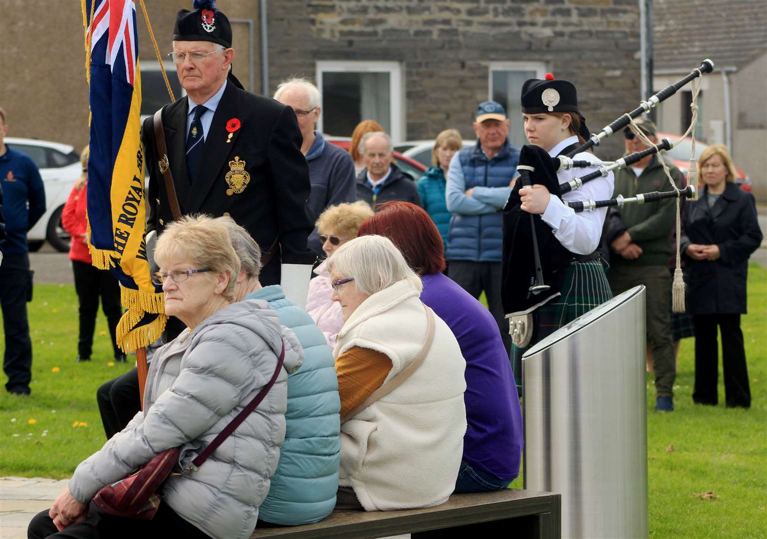Some of those watching the ceremony at the Braehead in Wick on Sunday. Picture: Alan Hendry