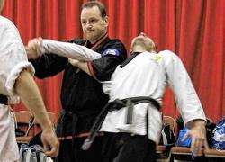 Vince Tait demonstrating techniques on KSD Martial Arts secretary Gary Beardsley at the seminar in the Assembly Rooms.