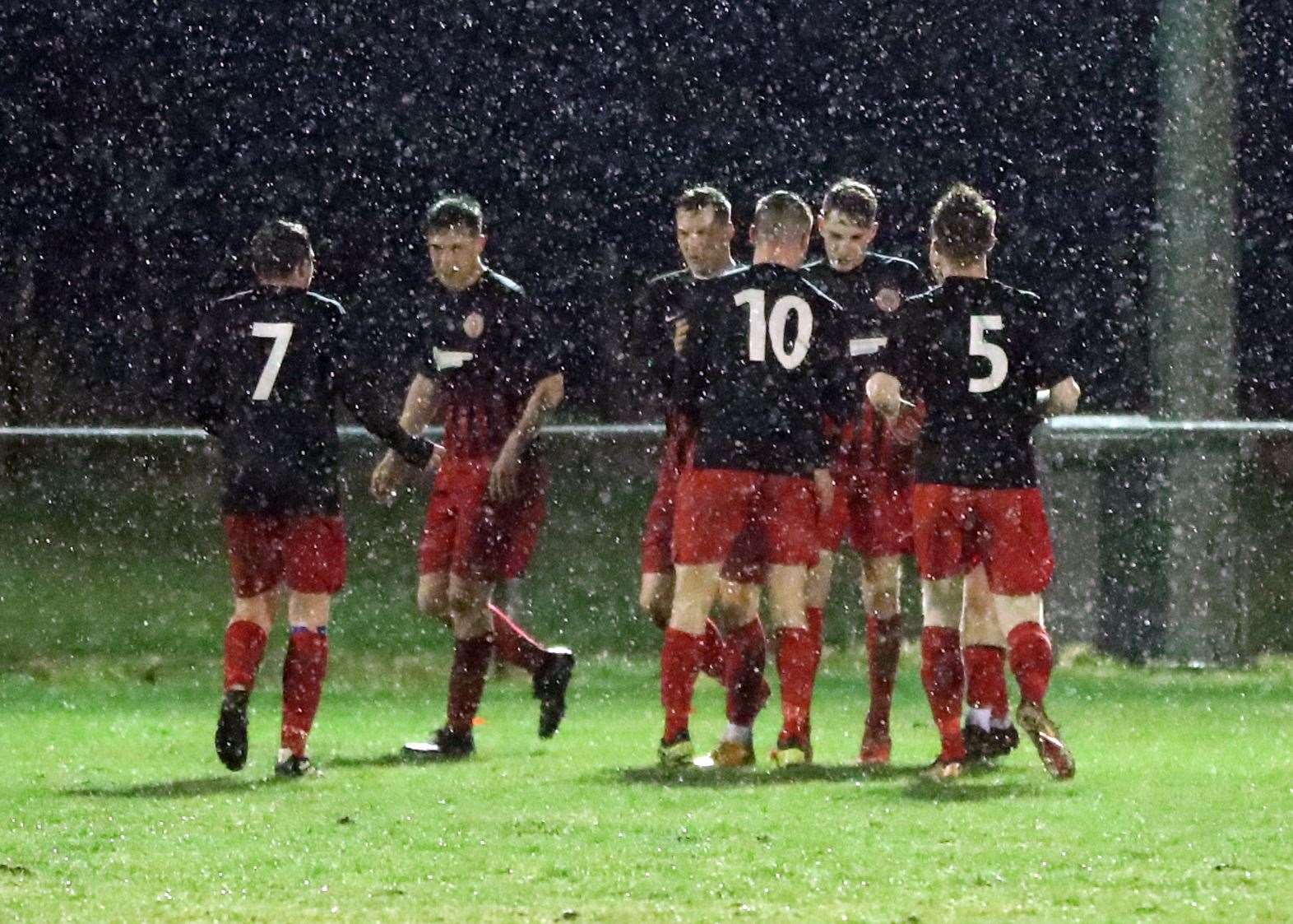 Halkirk United's Stuart Campbell (second right) is congratulated after opening the scoring with a goal direct from a corner at a wet Morrison Park. Picture: James Gunn