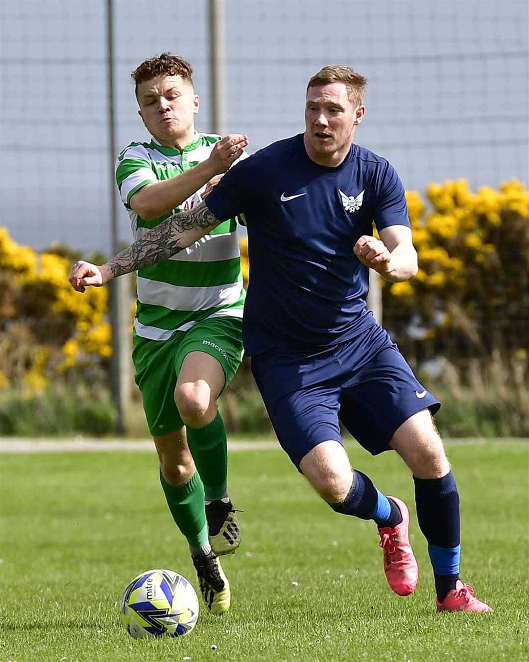 Aidan Reid of High Ormlie Hotspur – in action here against Helmsdale United's Kevin Cairns in a recent Highland Amateur Cup tie – is part of the Caithness AFA squad for the Archer Shield clash this weekend. Picture: Mel Roger