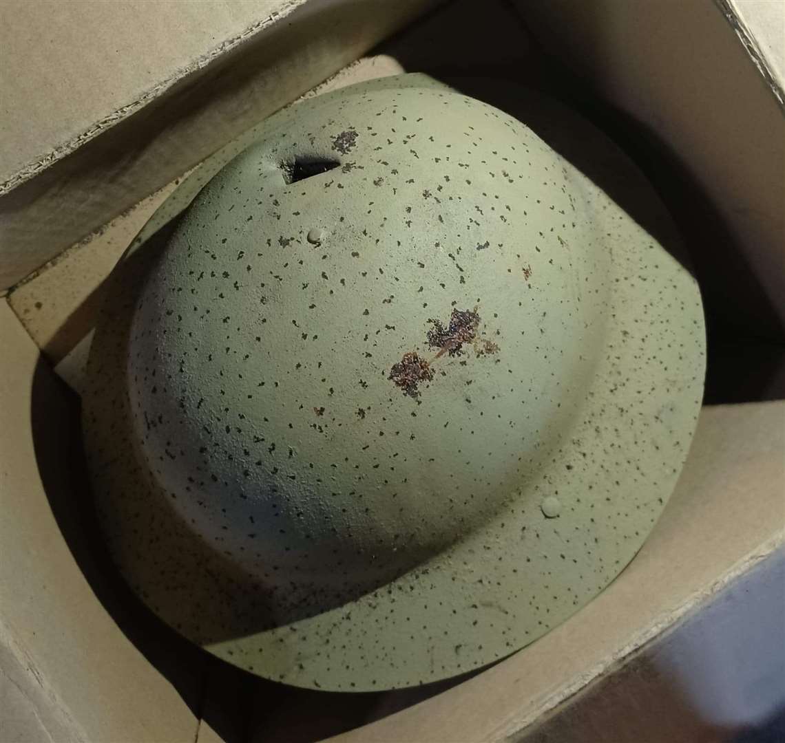 A bullet hole can be seen in the World War I helmet. Police are appealing for information on its whereabouts.