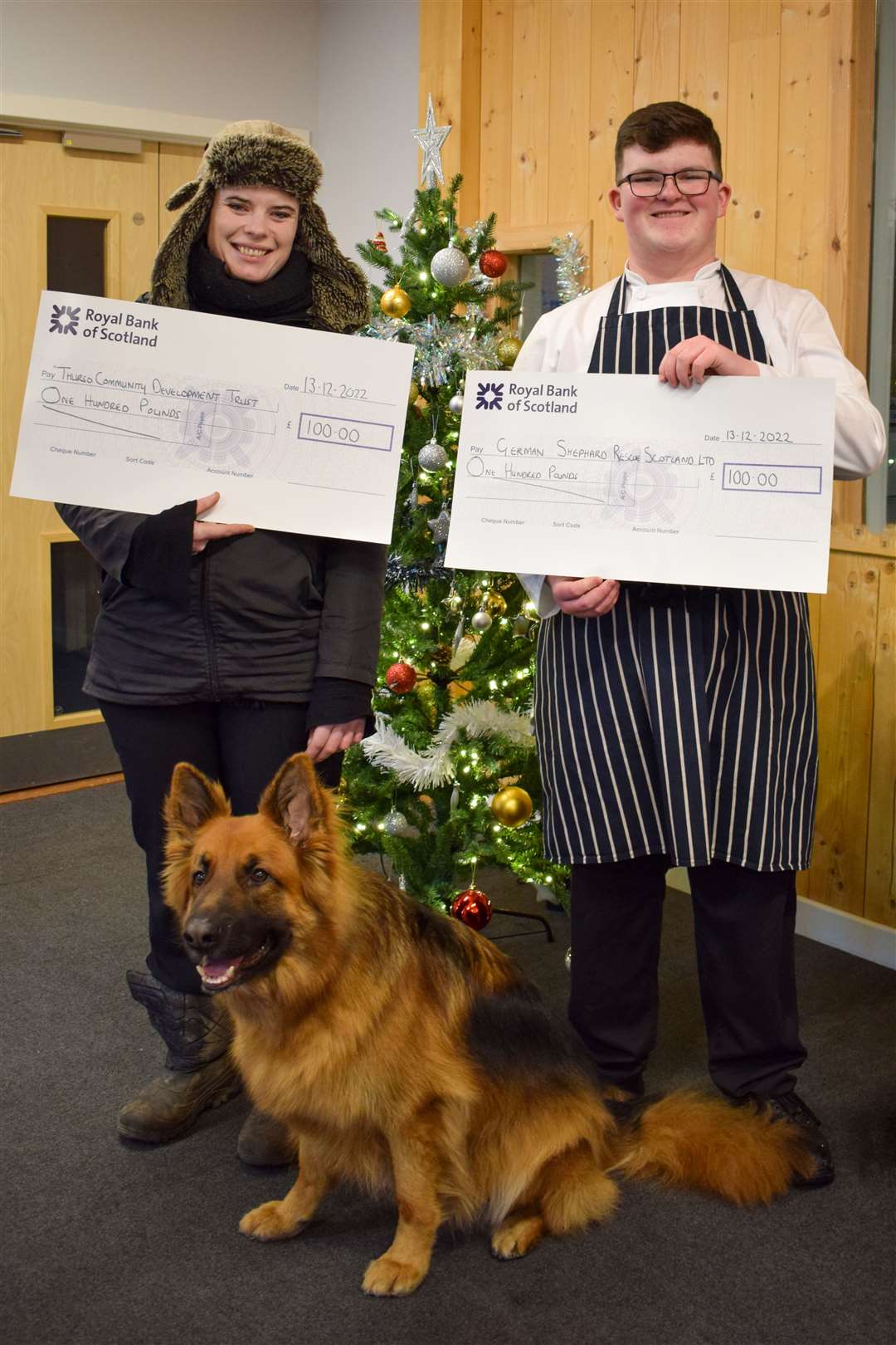 Thurso Community Development Trust's Sharon Dismore alongside professional cookery student James Manson, with Buddy, a rescue dog from German Shepherd Rescue Scotland.