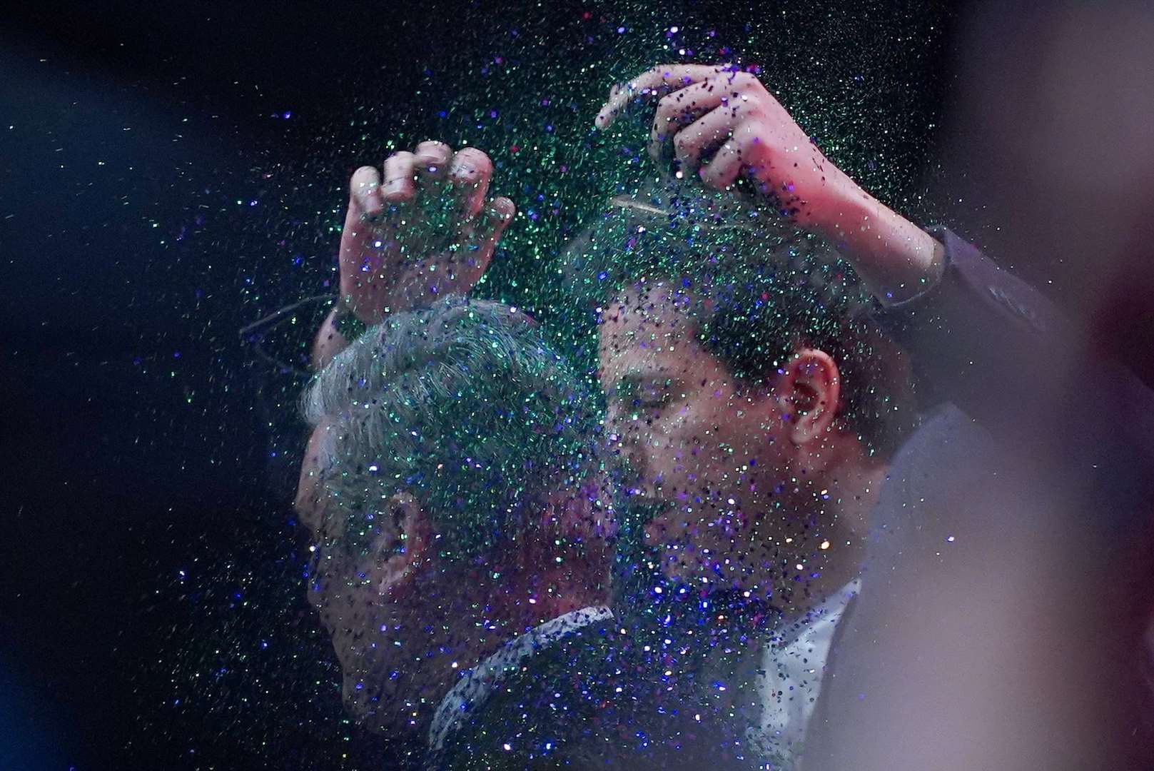 A protester throws glitter over Labour leader Sir Keir Starmer (Peter Byrne/PA)