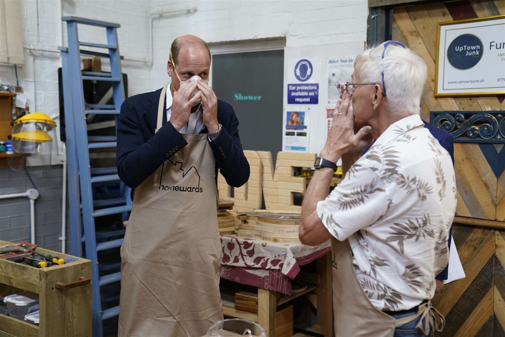 The Prince of Wales put on a mask before using a lathe (Andrew Matthews/PA)