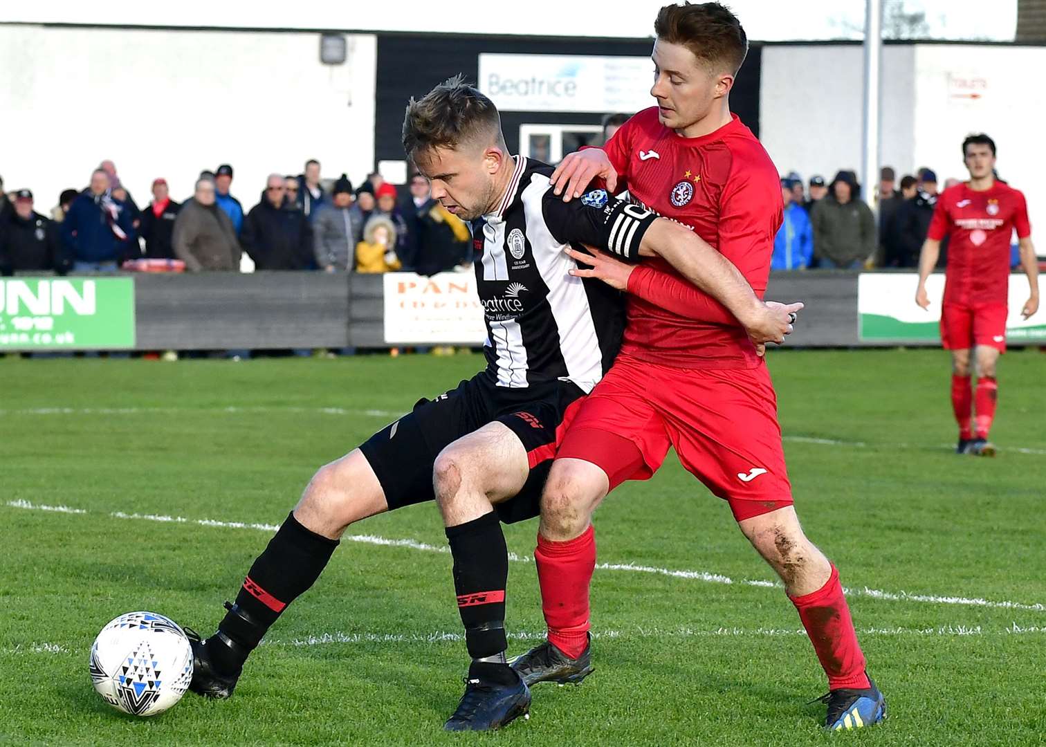 Alan Farquhar shielding ball from Andy Macrae during a match against Brora Rangers at Harmsworth Park. Picture: Mel Roger