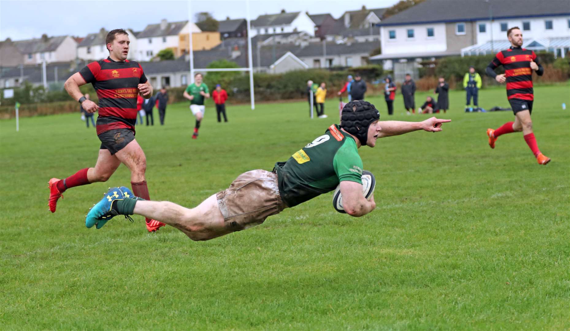 Scrum-half Kris Hamilton flies through the air to score his second try of the afternoon for Caithness against Grangemouth. Picture: James Gunn