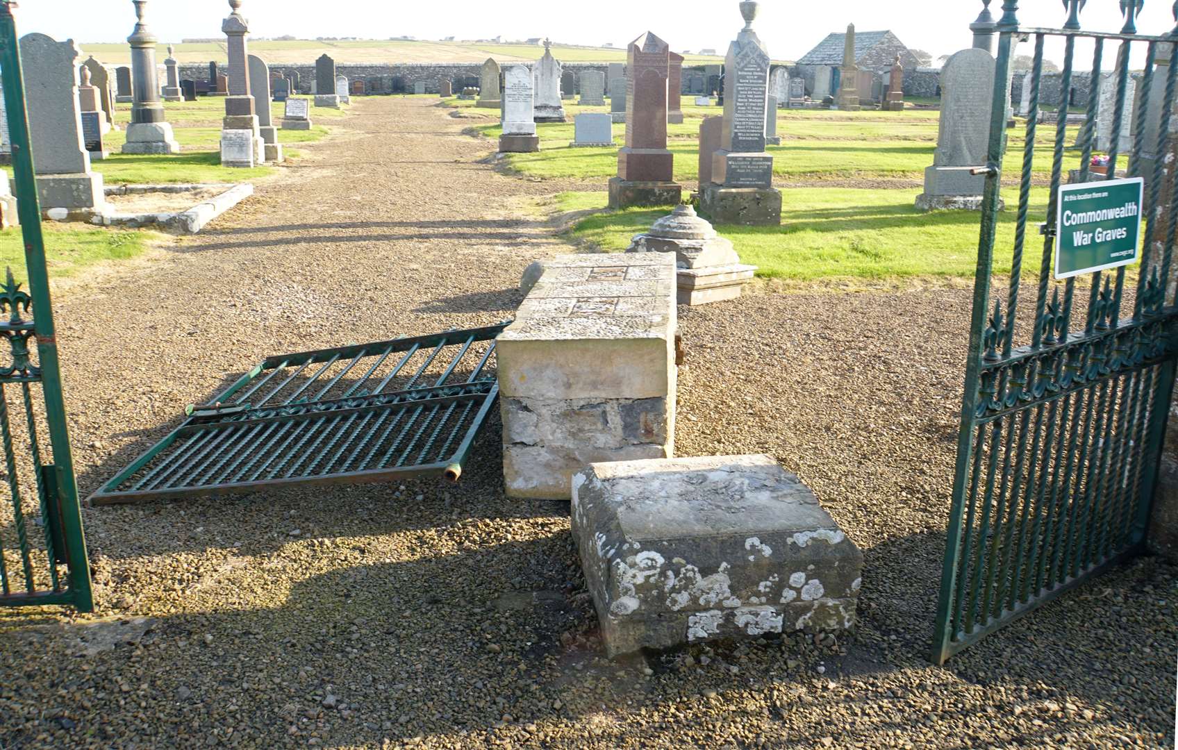 The large sandstone pillar lies smashed into four pieces at the entrance to Corsback cemetery. Pictures: DGS
