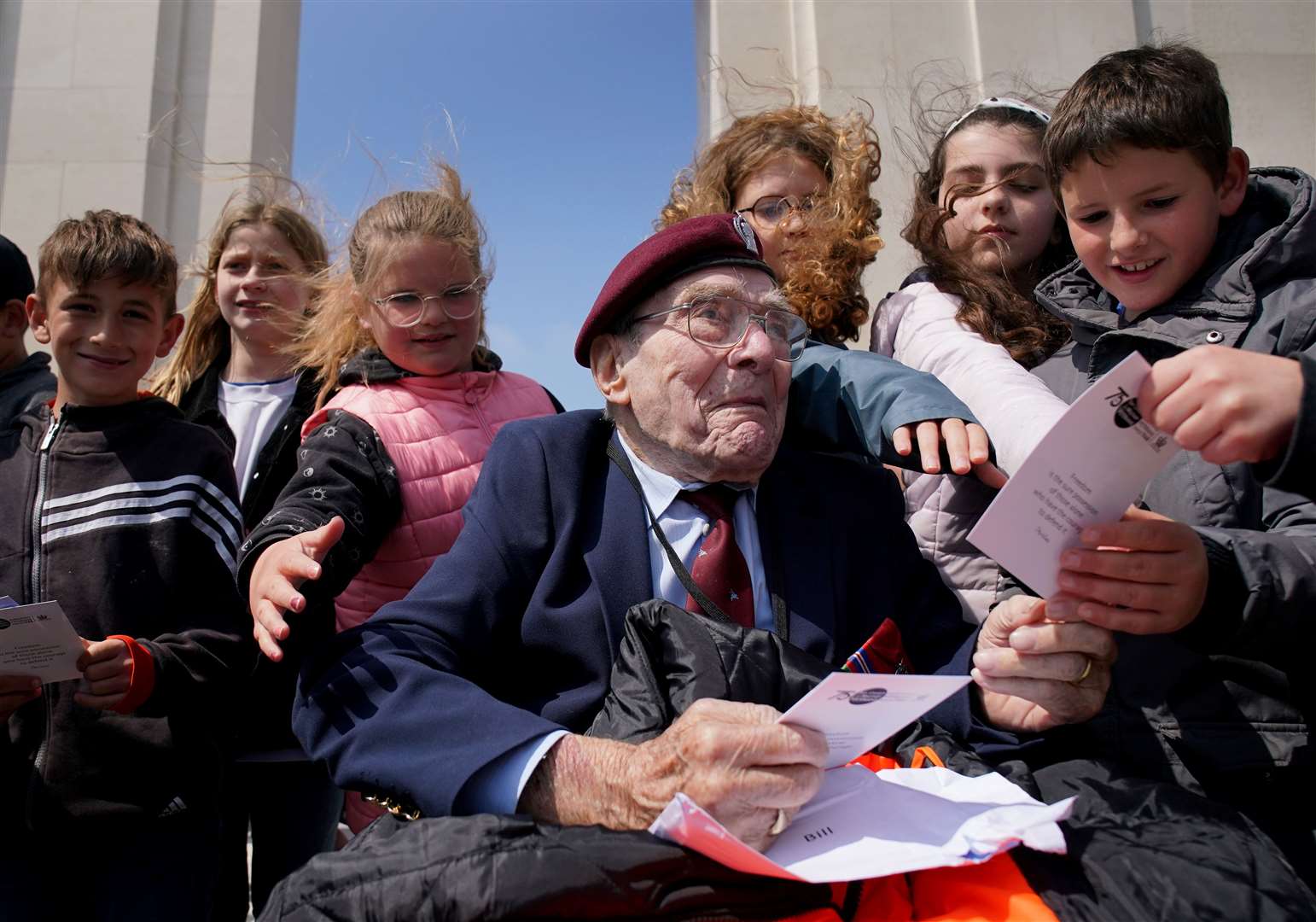 D-Day veteran Bill Gladden meeting local French schoolchildren at the British Normandy Memorial at Ver-sur-Mer in France (Gareth Fuller/ PA)