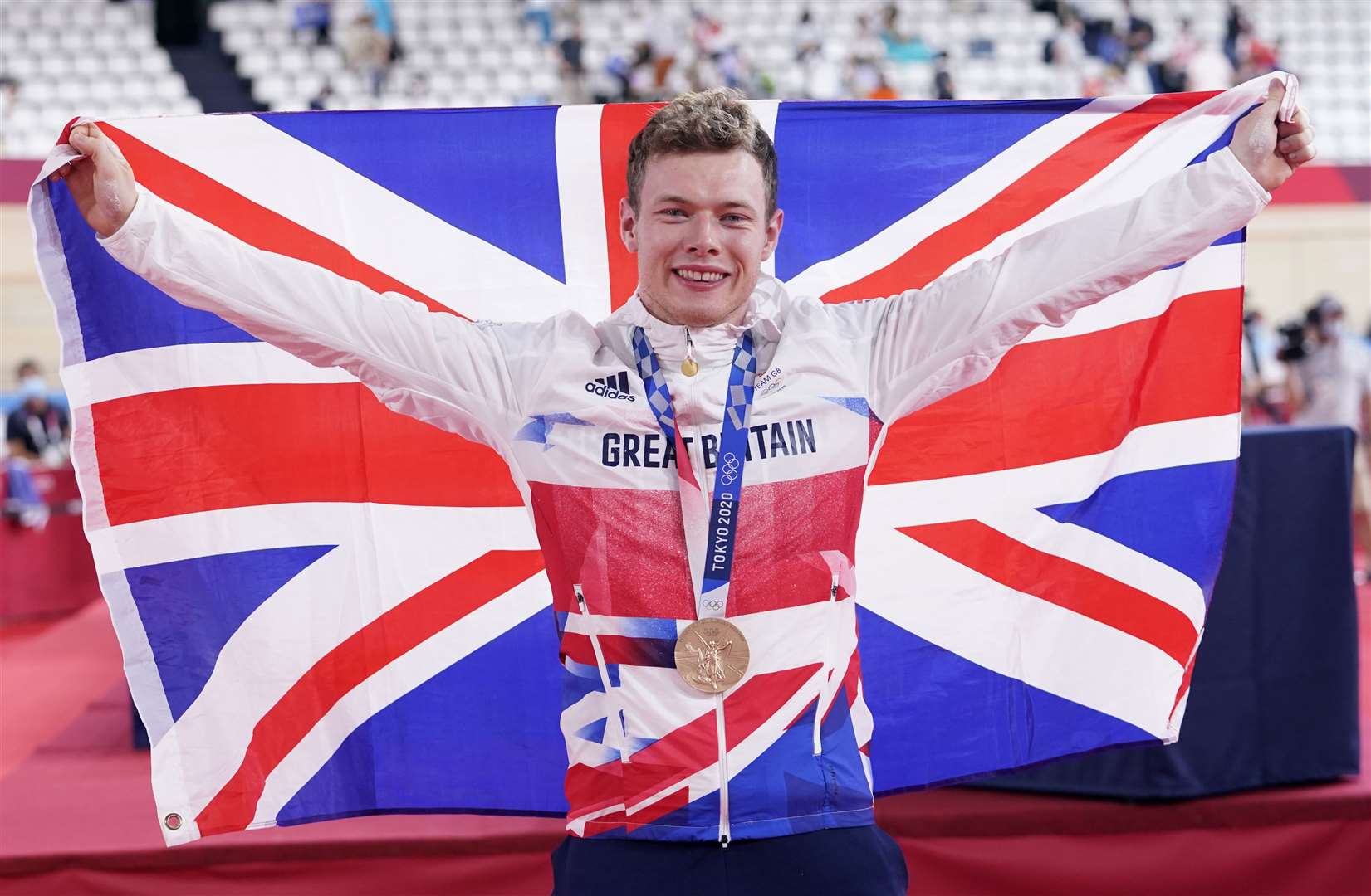 Great Britain’s Jack Carlin celebrates on the podium with the bronze medal (Danny Lawson/PA)