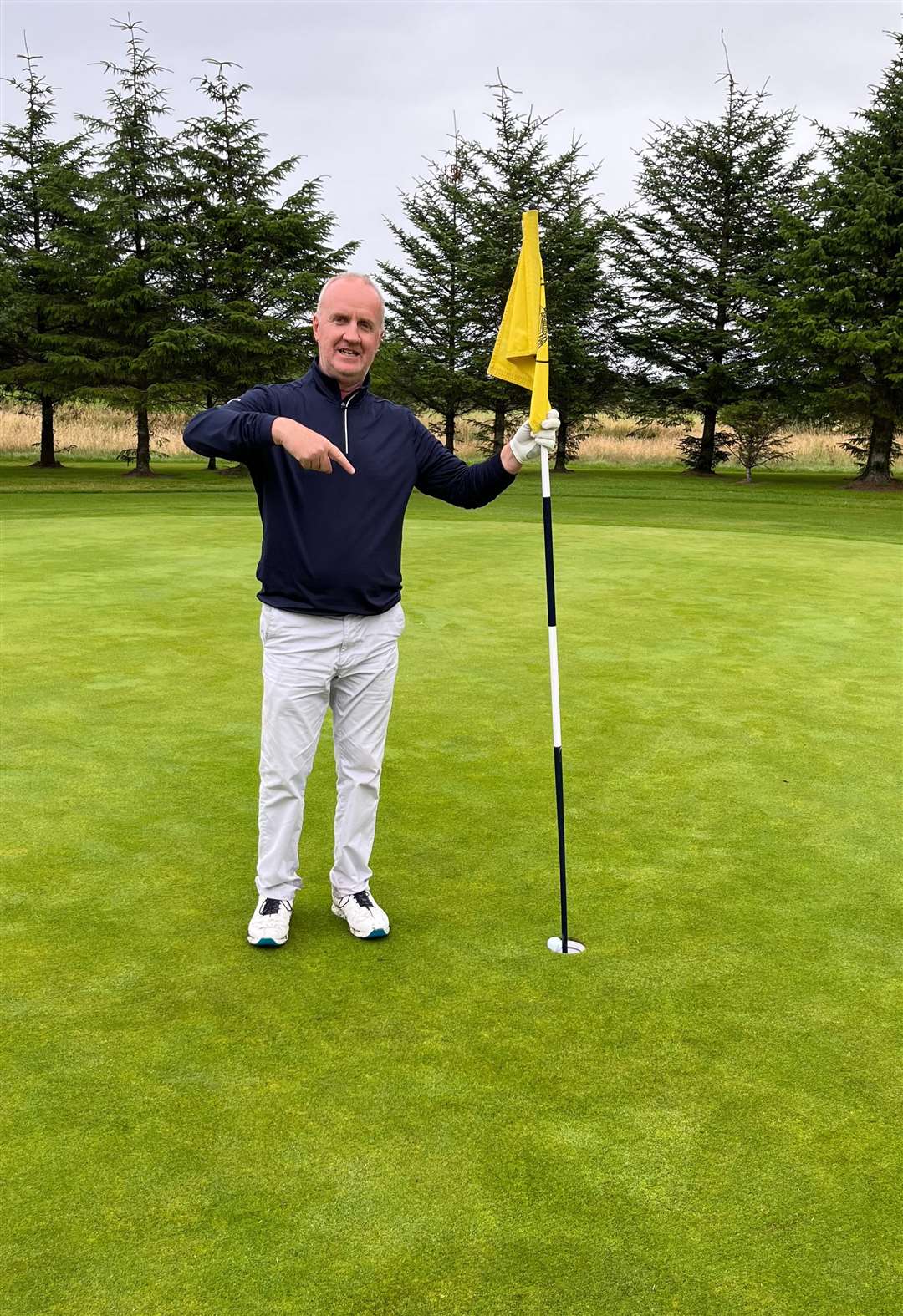 Thurso Golf Club's Alan Swanson at the ninth after his hole in one.