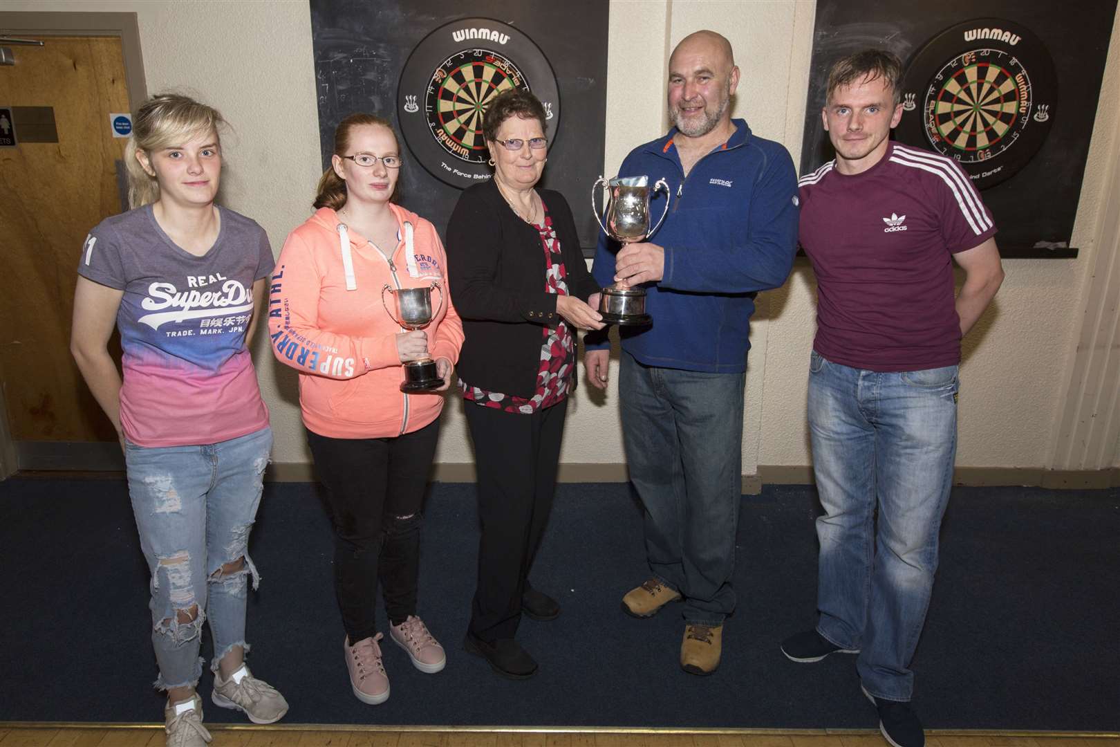 Wick and District Darts League's new season began with competitions for the Karen Burke Memorial Trophy and the Willie Keith Memorial Trophy. Kevin Macgregor, Seaview, won the Willie Keith trophy which was presented by Ann Taylor. Runner-up was Billy Davidson, Queen's 2. The Karen Burke trophy was won by Alison Tait (second left), with her Queen's team-mate Kara Sutherland runner-up. The competition was held in Harper's Bar. Picture: Robert MacDonald / Northern Studios.