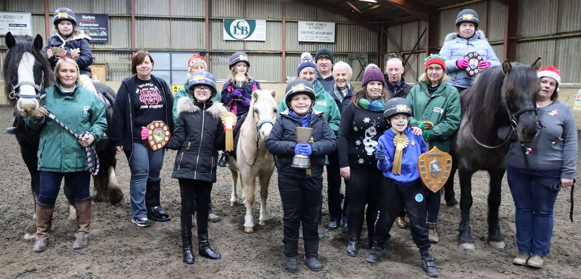 Prize winners from Ride 3 with coach Leeann Hope and helpers. The trophies and rosettes were presented by Jennifer Sutherland, James Moodie, Lodge St Peter, Colin Forsyth and Dottie Lyon (Team MCC). Picture: Neil Buchan