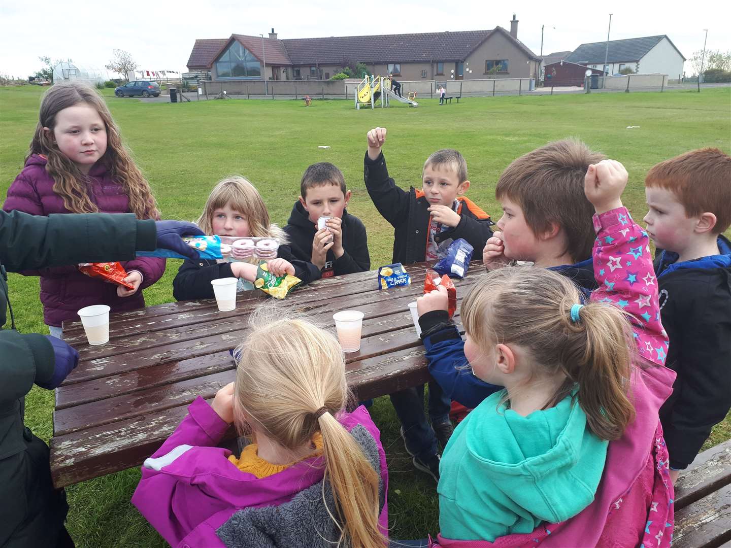 Some children from the Thrumster Youth Club enjoy a snack during one of the outdoor activities Caithness Community Connections organised last October.