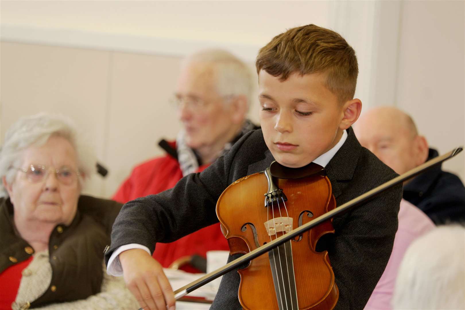 Caalin Rosie played a few tunes on his violin at Tuesday's event. Picture: Eswyl Fell