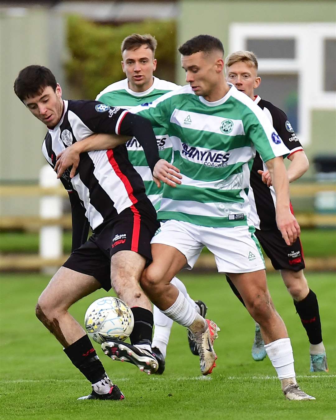 Wick Academy forward Kyle Henderson beats Buckie's Scott Adams to the ball. Picture: Mel Roger