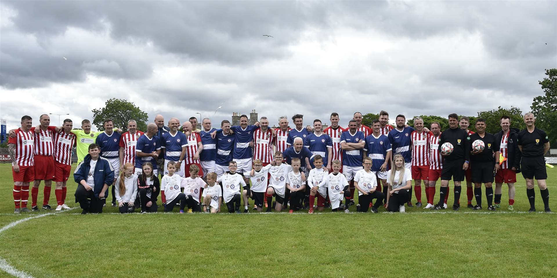 The teams, mascots and match officials line up before the Thurso 999 Services v Rangers Legends charity match at the Dammies on Saturday. Picture: Mel Roger
