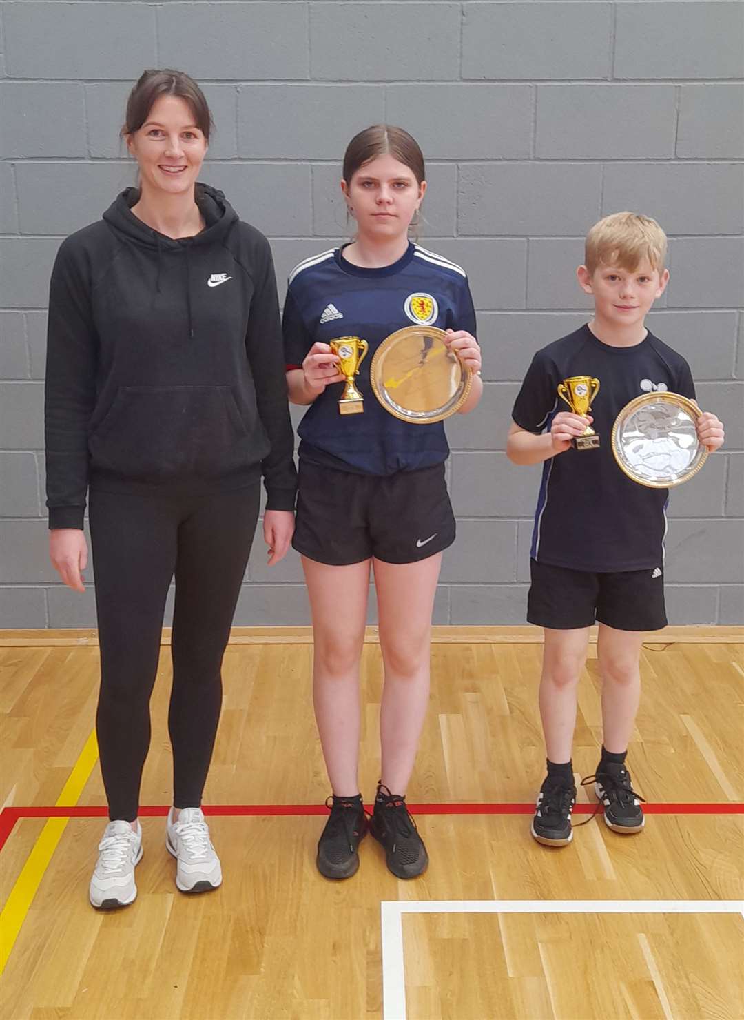 Winners Ashlyn Gunn and Rory Nicolson with Shona Mackay, a junior coach for Caithness Badminton Association. Picture: Kerry Mackenzie