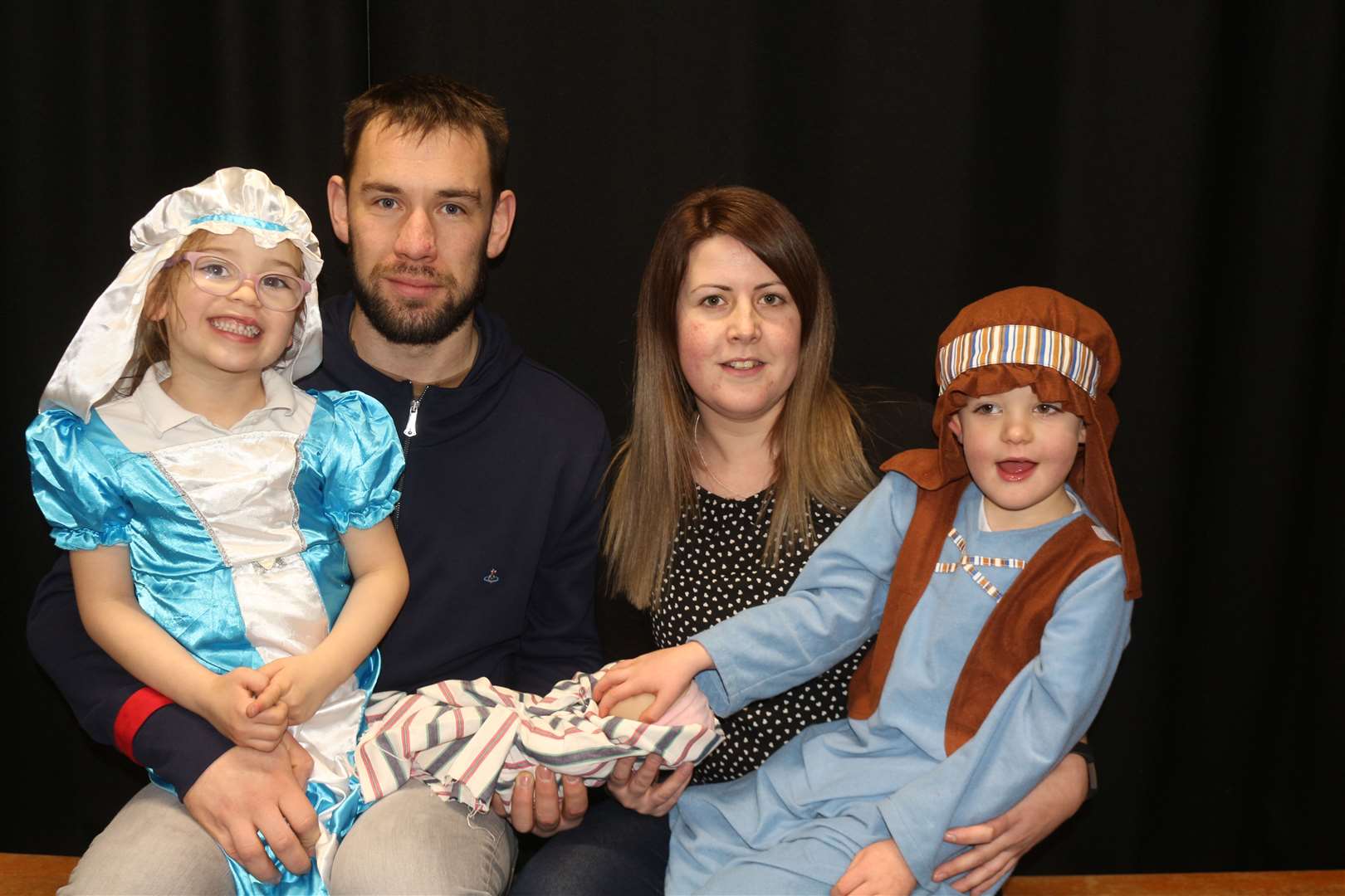 Alba Mackenzie and Jordan Shearer, who played Mary and Joseph, with their respective parents Marc Mackenzie and Claire Shearer.