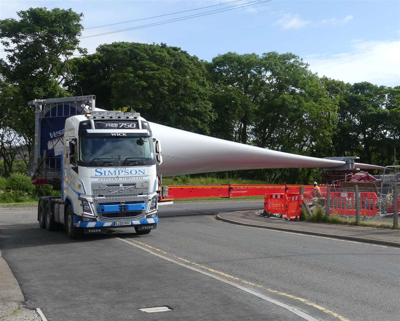 One of the turbine parts being taken round the corner at the top of Station Road. Picture: Peter Sutherland, Golspie