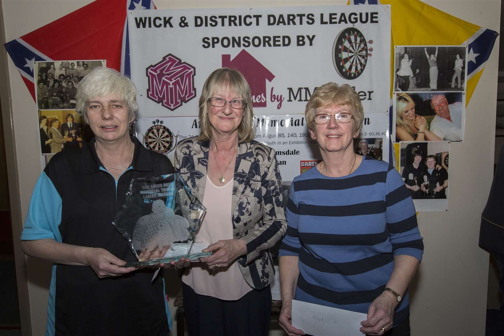 Freda Perry (left), of the Queen's, won the ladies' section of Angus Ross memorial trophy competition played in Harper's Bar on Saturday. The trophy was handed over by Angus's widow, Marina. Runner-up was Ann Wells (Seaforth). Picture: Robert MacDonald / Northern Studios