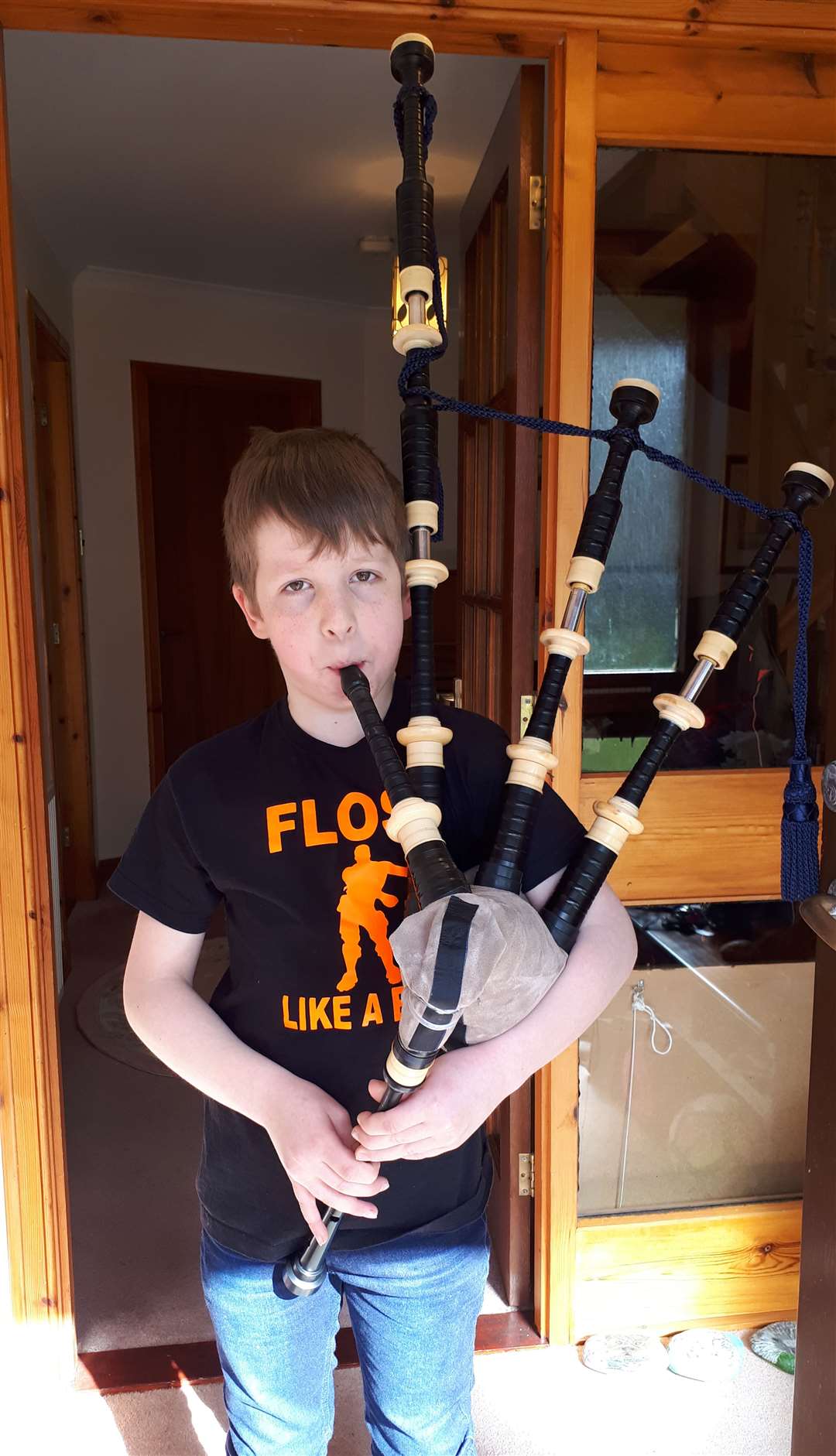 Ten-year-old Andrew Sinclair supported the campaign by playing the bagpipes at his home in Latheron.