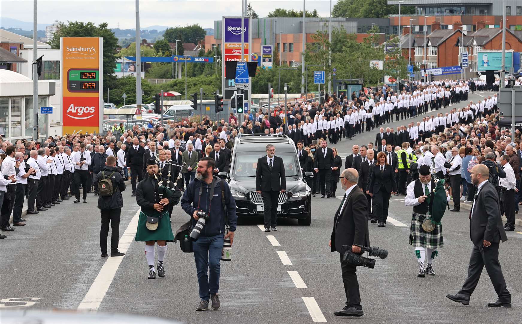 The funeral procession of senior republican Bobby Storey following a service at St Agnes’ Church in west Belfast (Liam McBurney/PA)