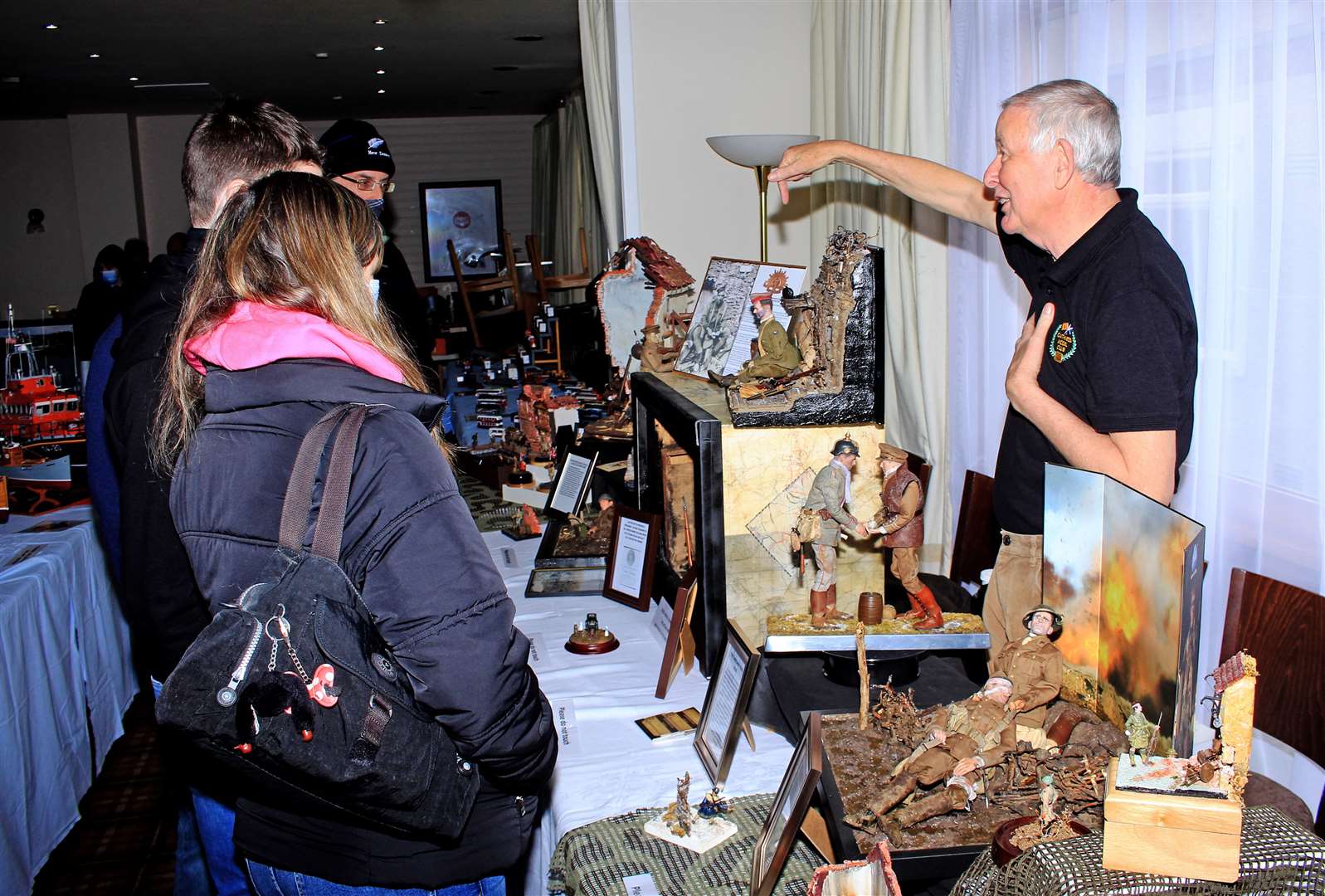 John Brotherston telling visitors about his painstakingly created World War I scenes. Picture: Alan Hendry