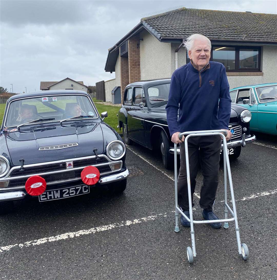 Resident Clive Winfield with some of the cars.
