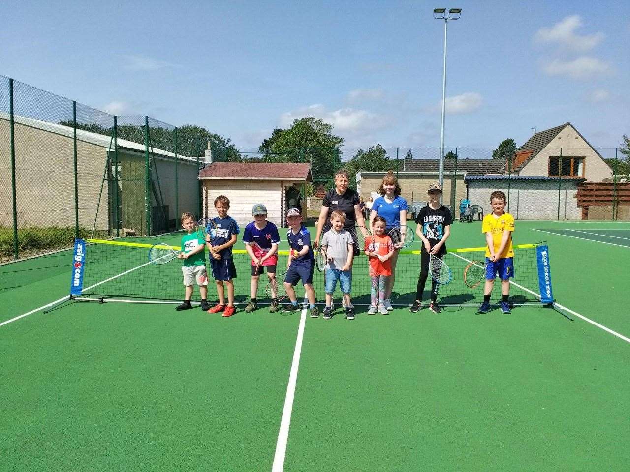 Coach Carole Cameron and young leader Ellie Sutherland with children who took part in the recent sessions.