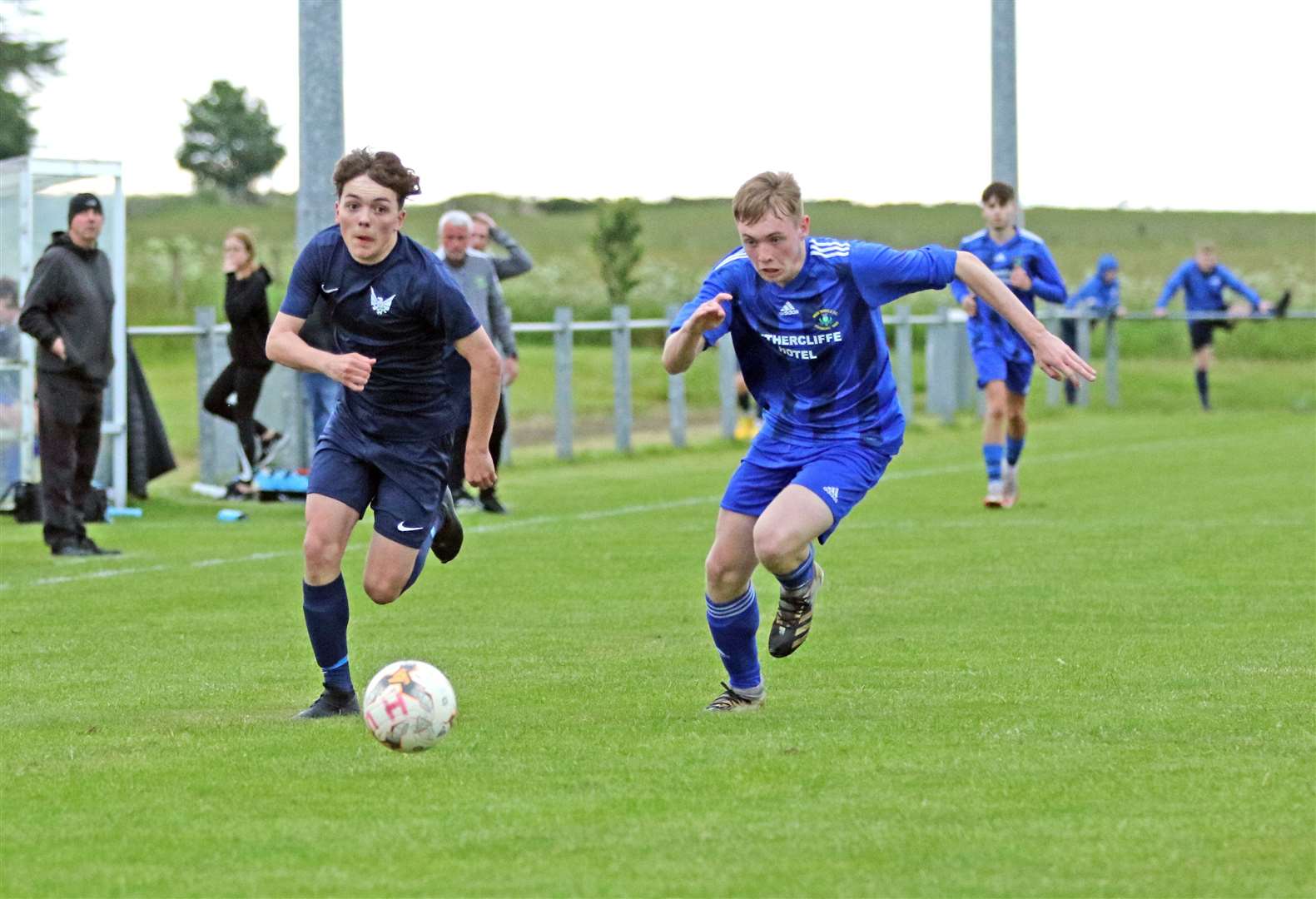 High Ormlie Hotspur forward William Cannop tries to outpace Wick Thistle's Ryan Henderson. Picture: James Gunn