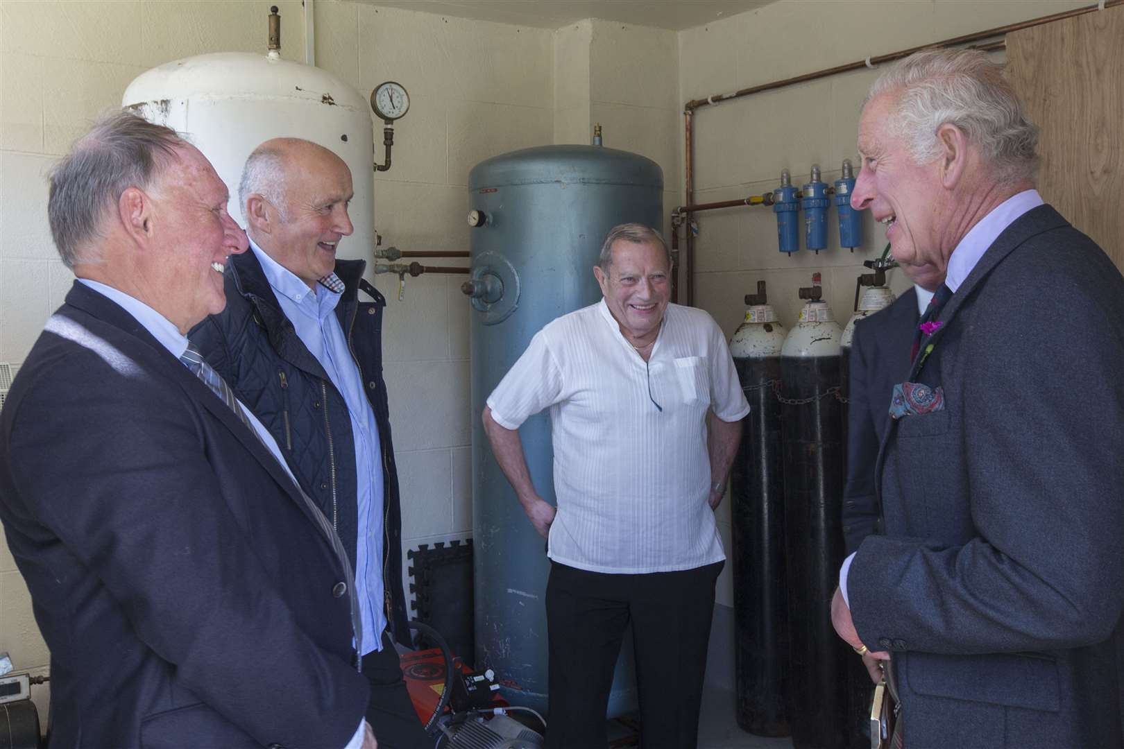 The Duke of Rothesay chats with David Steven (left), managing director of D Steven & Son, the haulage firm that transports the Healing Hub oxygen cylinders, and one of his drivers, Alex Martin. Looking on is Healing Hub volunteer Alan Mowat. Picture: Robert MacDonald / Northern Studios