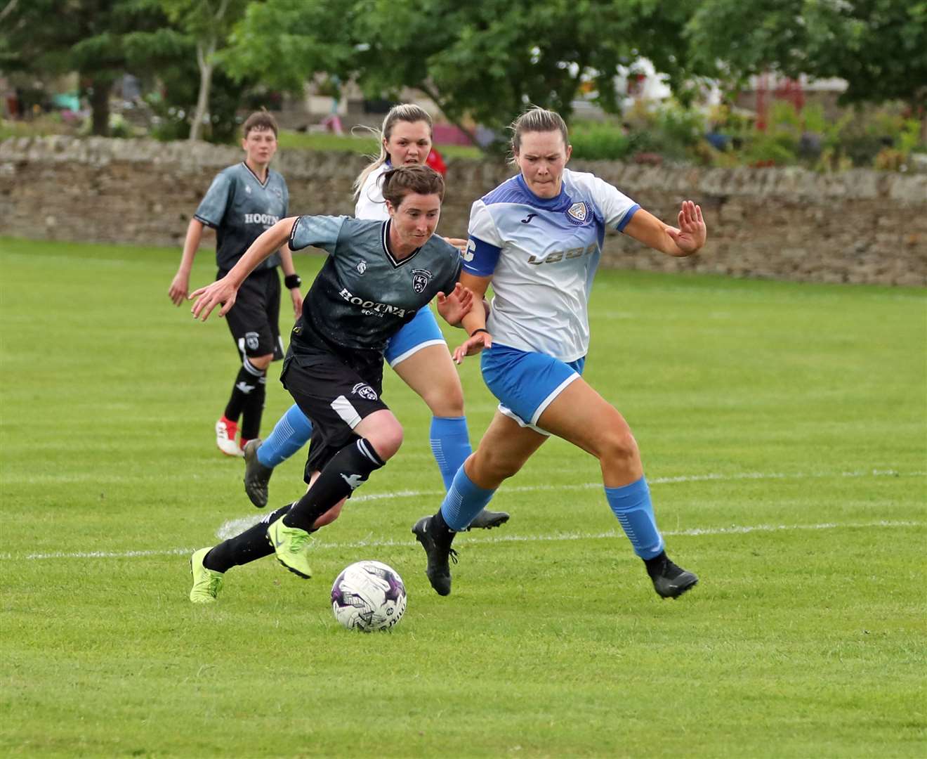 Sophie Kinghorn of Caithness Ladies tries to get past Sutherland's Erin Johnstone in the semi-final at Castletown. Picture: James Gunn