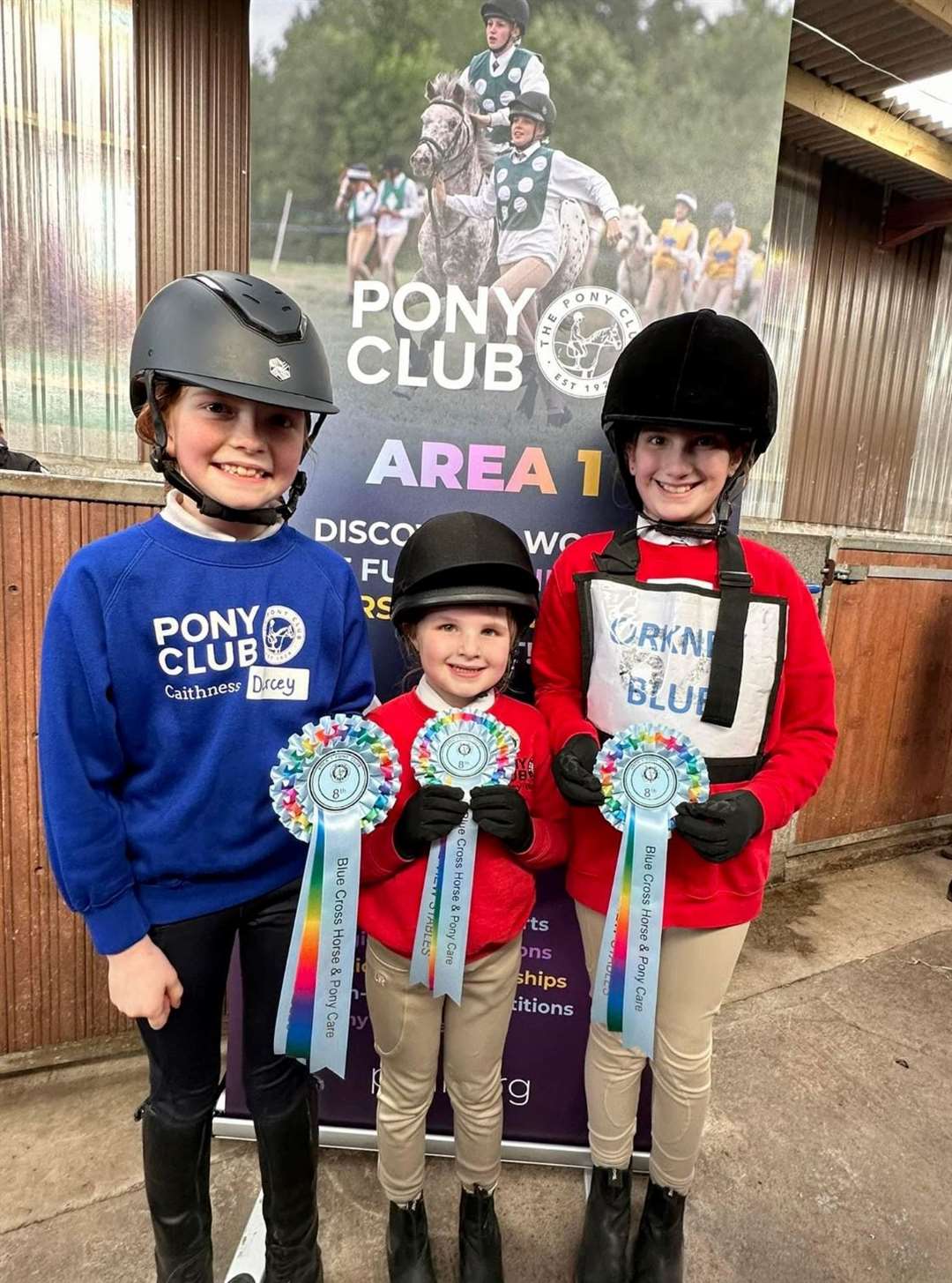 Eighth-placed minis Darcey Alexander (left) and two Orkney members.